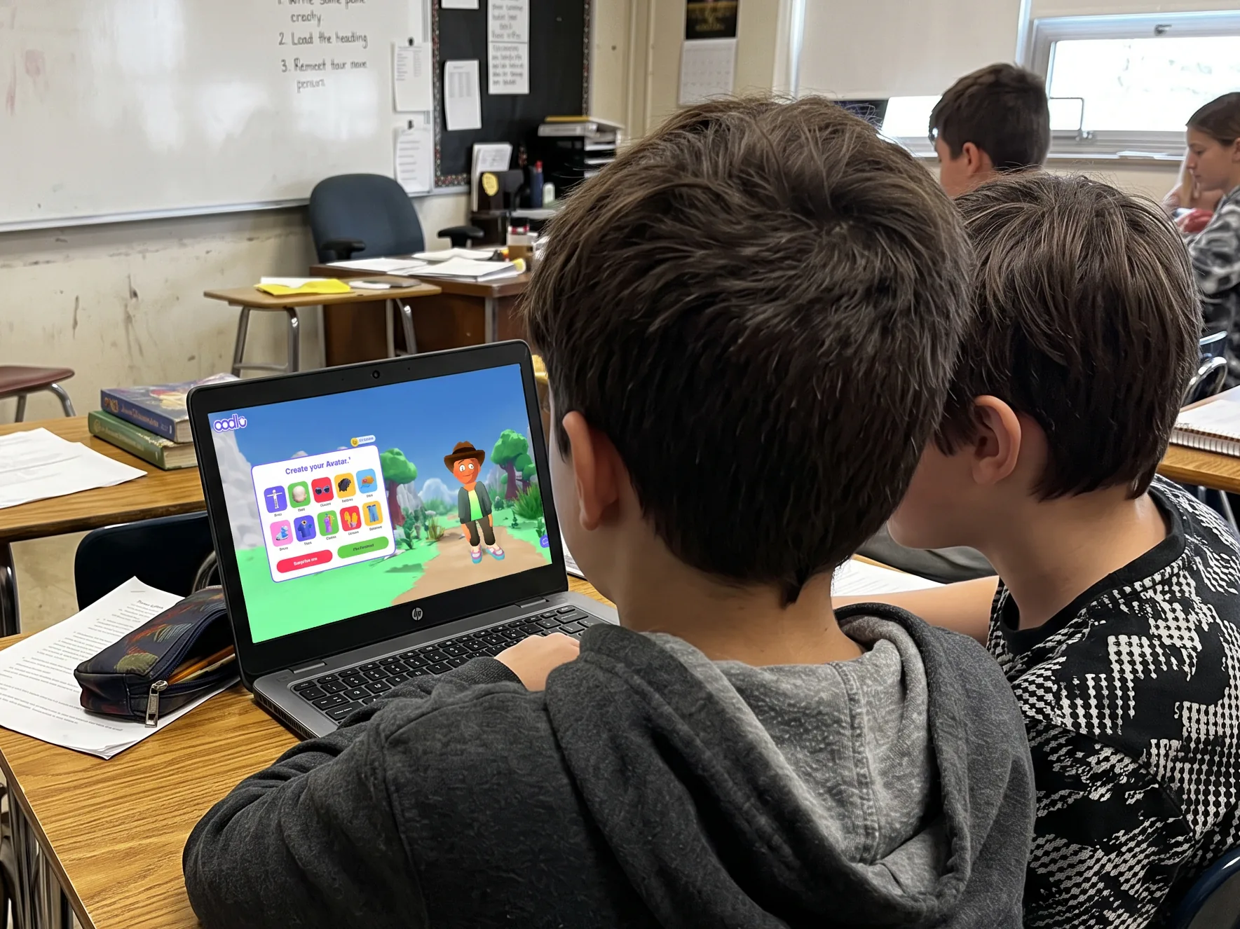 Pupils in a classroom playing a learning game on tablets