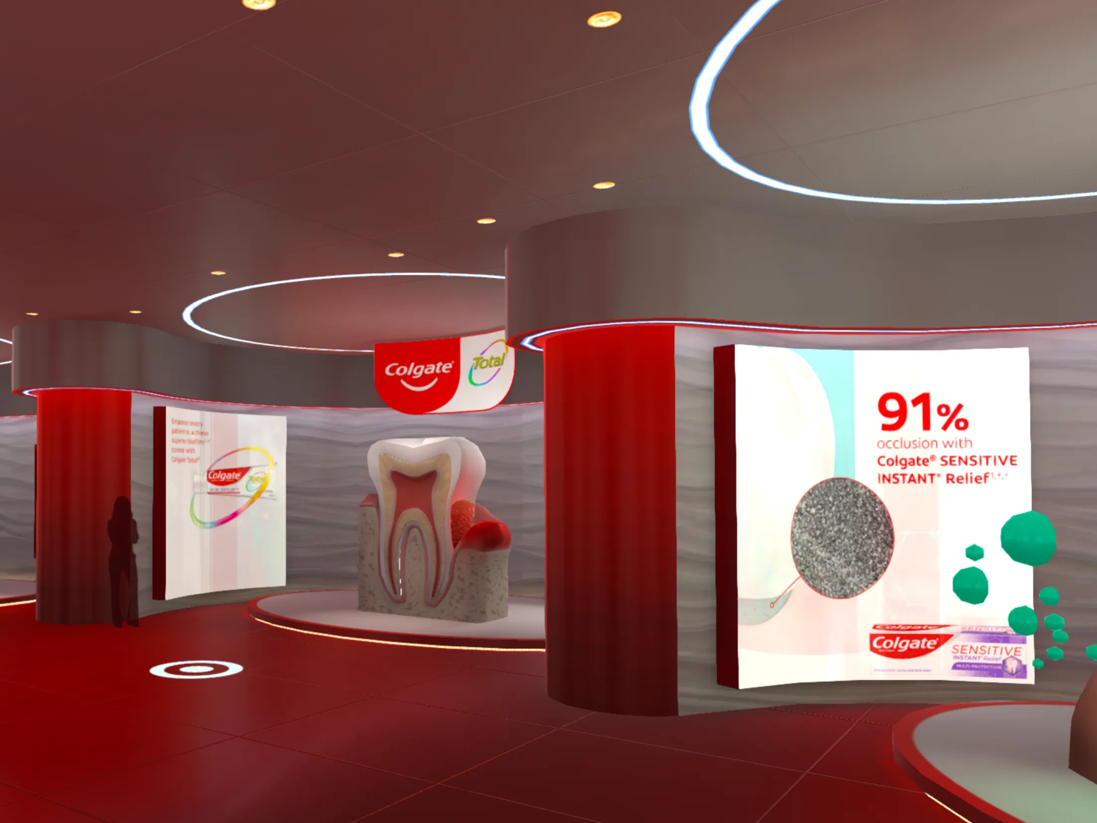A red-themed virtual exhibition space with large screens showing product displays and a tooth cross-section model